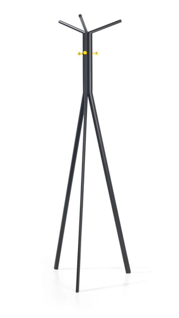A black coat-stand with the base of a tripod. It is tall and narrow and made entirely of metal tubes. In the upper part, a few small yellow hooks can be seen.