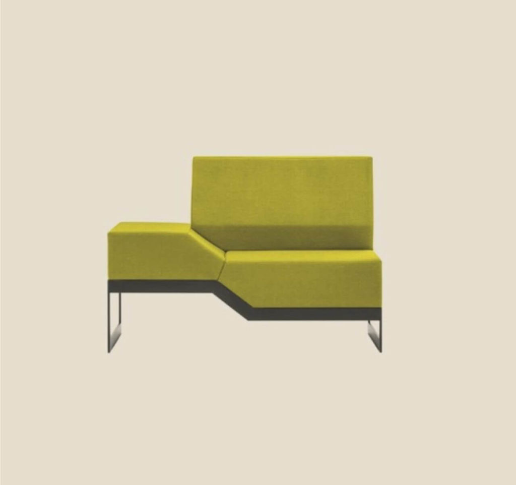 A sofa composed of several portable modules. It is mostly made of green soft material on black steel legs. Its backrest is rectangular and is attached to three quarters of the object. The remaining part, without the backrest, is set slightly higher.