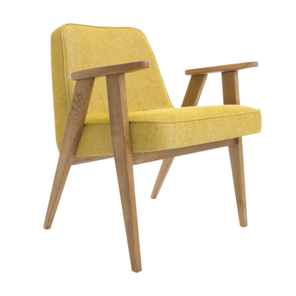 A comfy armchair with wooden legs and armrests. Soft yellow material is used for the seat and backrest. The number ‘366’ is engraved on the right arm.